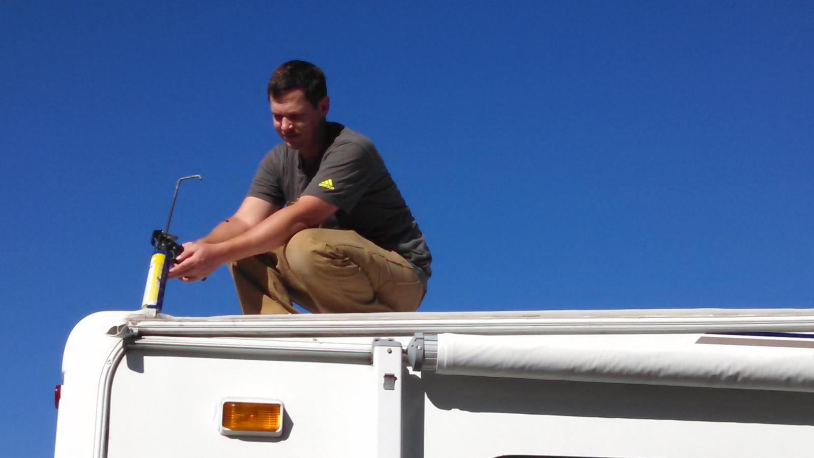 Man doing maintenance work an RV